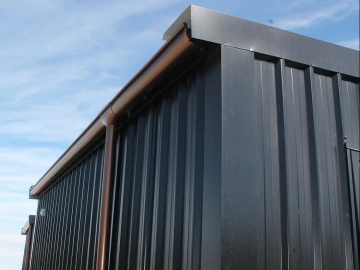 Roof edge and black steel cladding against the sky